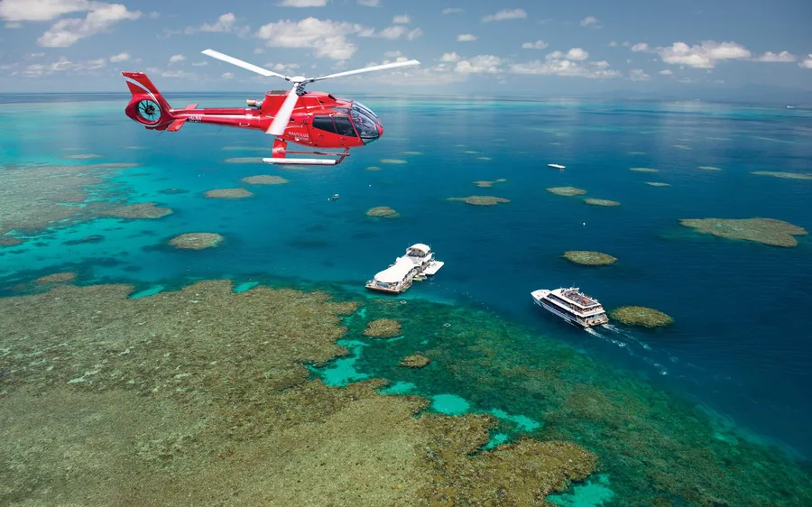 A helicopter beside a reef pontoon in the Coral Sea